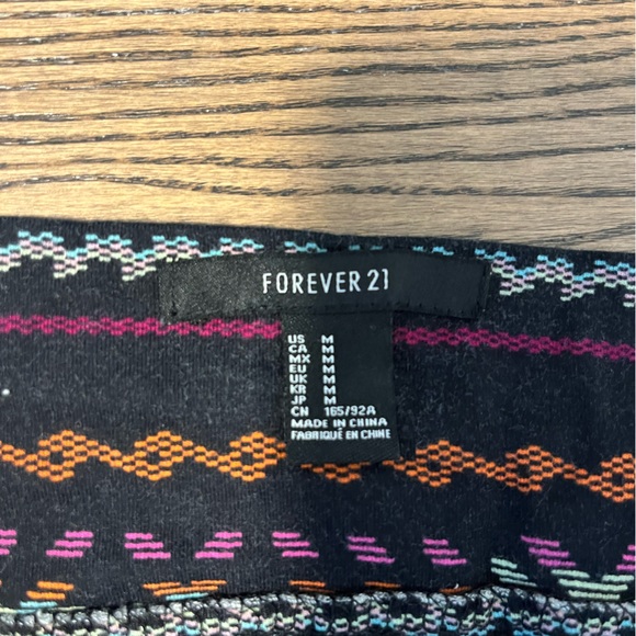 Forever21 - size medium, multi-colour patterned over black, mini skirt. - Picture 2 of 2
